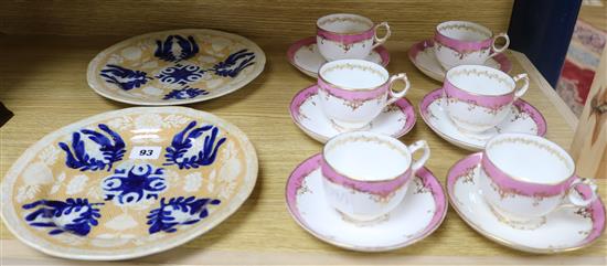A set of six Victorian porcelain tea cups and saucers and two plates